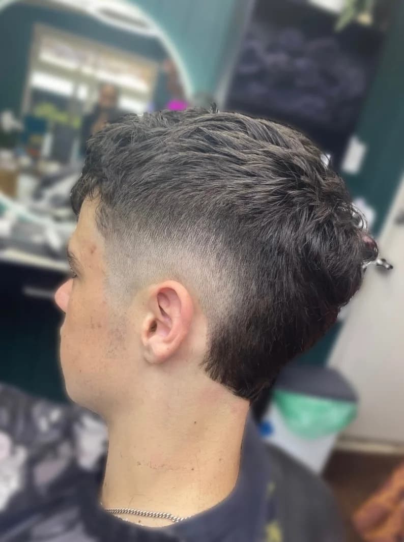 Close-up of a textured fade haircut at Bear Cave Barbershop